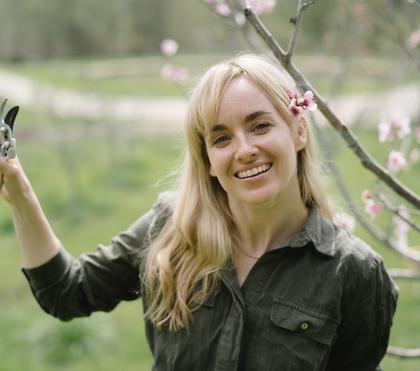 Woman holding small pruners
